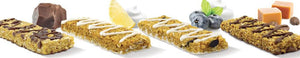 Four No Nuts nut-free snack bars in different flavors with chocolate, lemon, blueberry, and caramel.