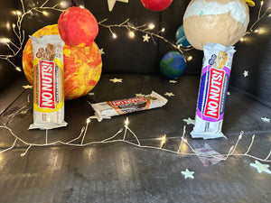 No Nuts! nut-free snack bars displayed with colorful planets and string lights