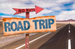 No Nuts road trip sign on highway, promoting nut-free snack bars for safe travel