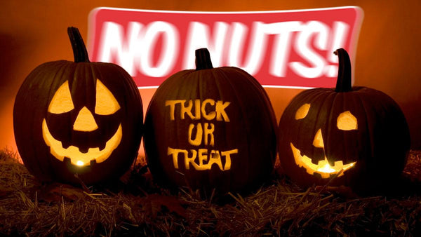 Nut-free Halloween theme with carved jack-o-lanterns and No Nuts! sign in the background