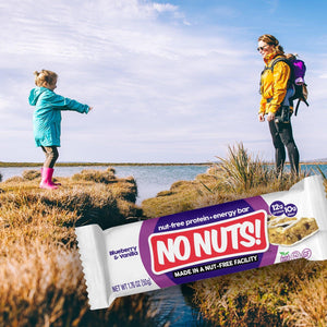 No Nuts! Blueberry Vanilla nut-free protein bar outdoors with child and adult hiking by water