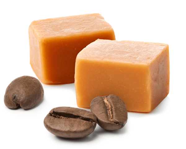 Nut-free caramel fudge squares with coffee beans on white background, No Nuts allergy-friendly snack