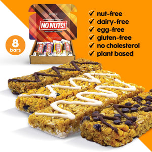 Assorted No Nuts nut-free snack bars and packaging with allergy-friendly labels on orange background.
