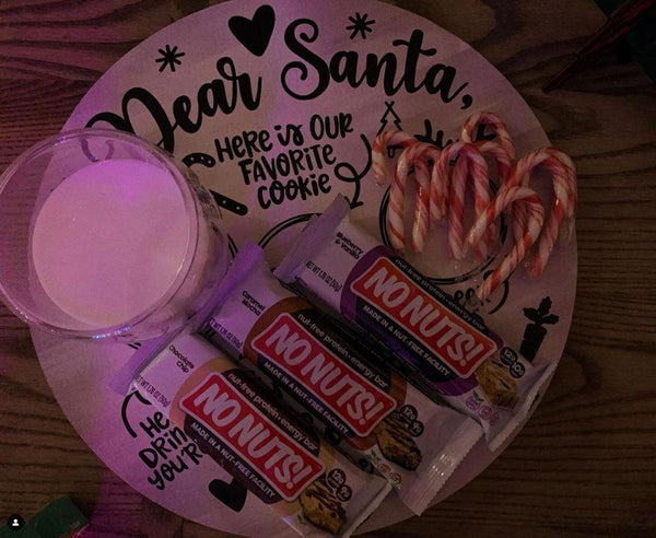 Nut-free No Nuts bars, candy canes, and milk on holiday plate for Santa