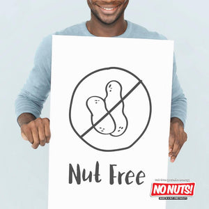 Smiling person holding Nut Free sign with No Nuts! nut-free snack bars logo