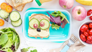 School lunch with nut-free sandwich, fresh veggies, and fruit in a kid-friendly bento box.