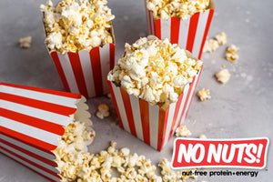 Nut-free popcorn in red and white striped boxes with No Nuts! allergy-friendly snack branding