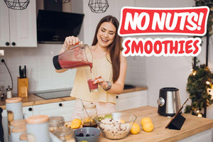 Smiling woman making nut-free smoothie in kitchen with fresh fruit, No Nuts! branding visible.
