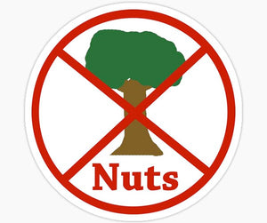 No nuts sign with red circle and slash over a tree, nut-free allergy-friendly symbol