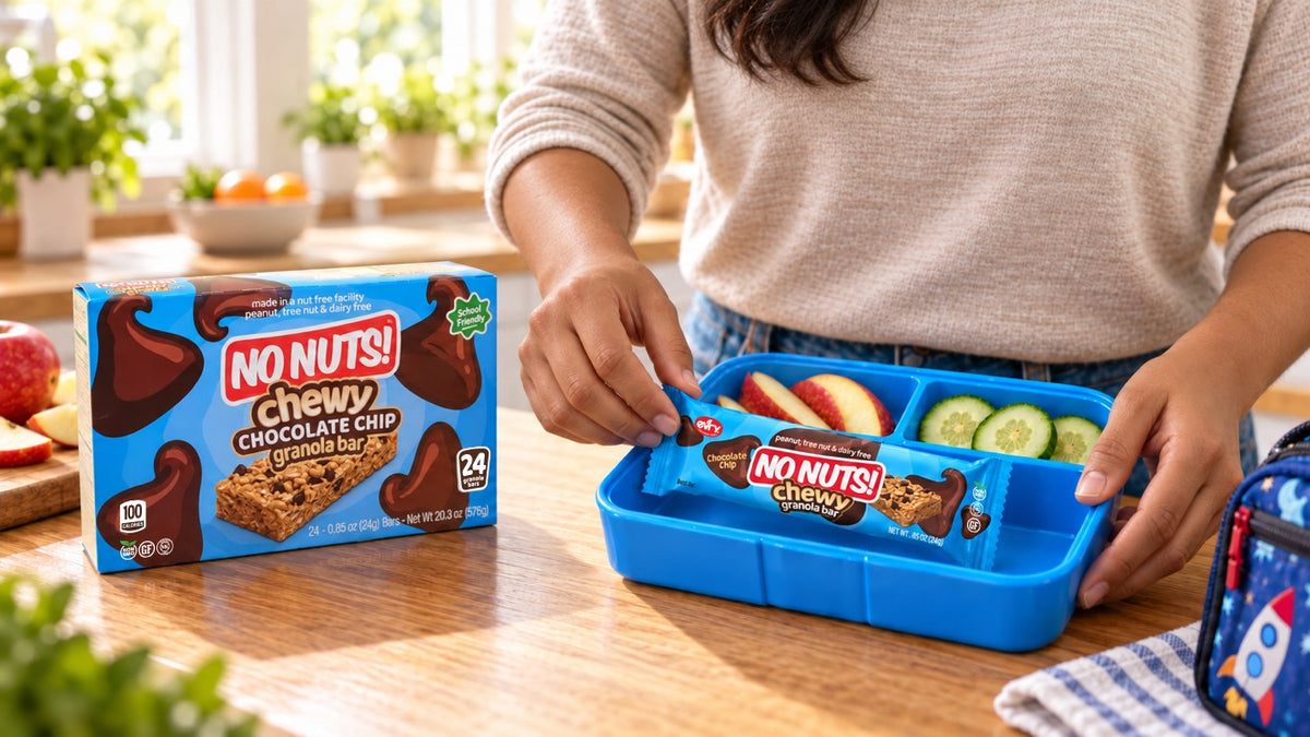 Parent packing a No Nuts! chewy nut-free granola bar into a school lunchbox