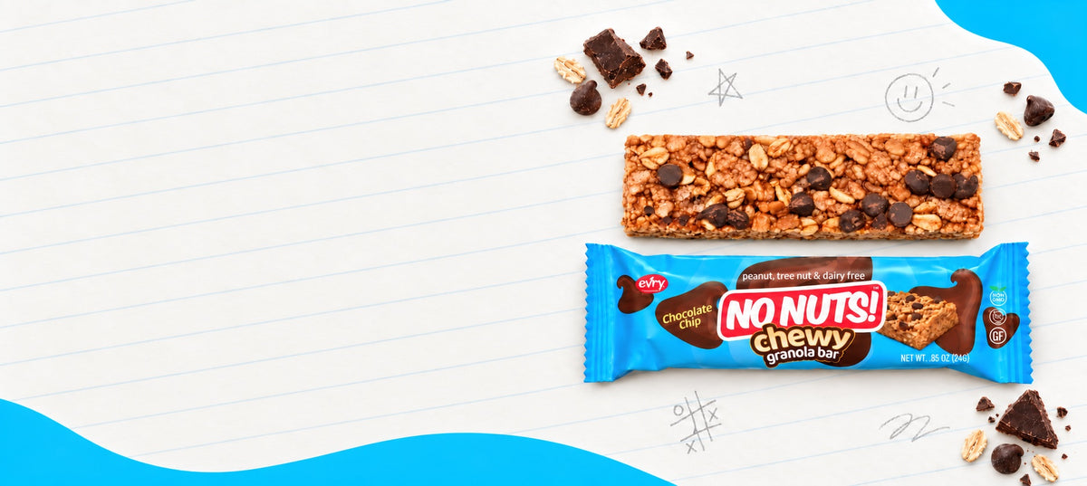 No Nuts! Chewy Chocolate Chip nut-free granola bar, unwrapped and in its blue wrapper, on lined notebook paper